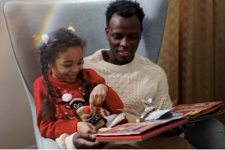 Dad reading to Daughter