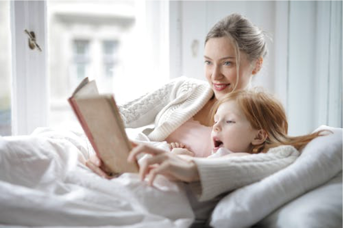Mom reading to Daughter